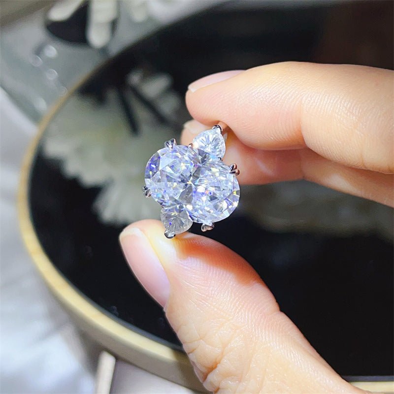 Oval Three-Stone Moissanite Halo Ring – image 1